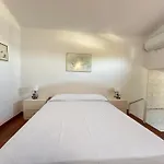 Agi Poncella *
